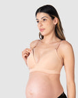 Close-up of Kami, pregnant mother of two, demonstrating the functionality of the HOTMILK US nursing and maternity bra named AMBITION T-SHIRT WIREFREE in maple, featuring the convenient magnetic nursing clip