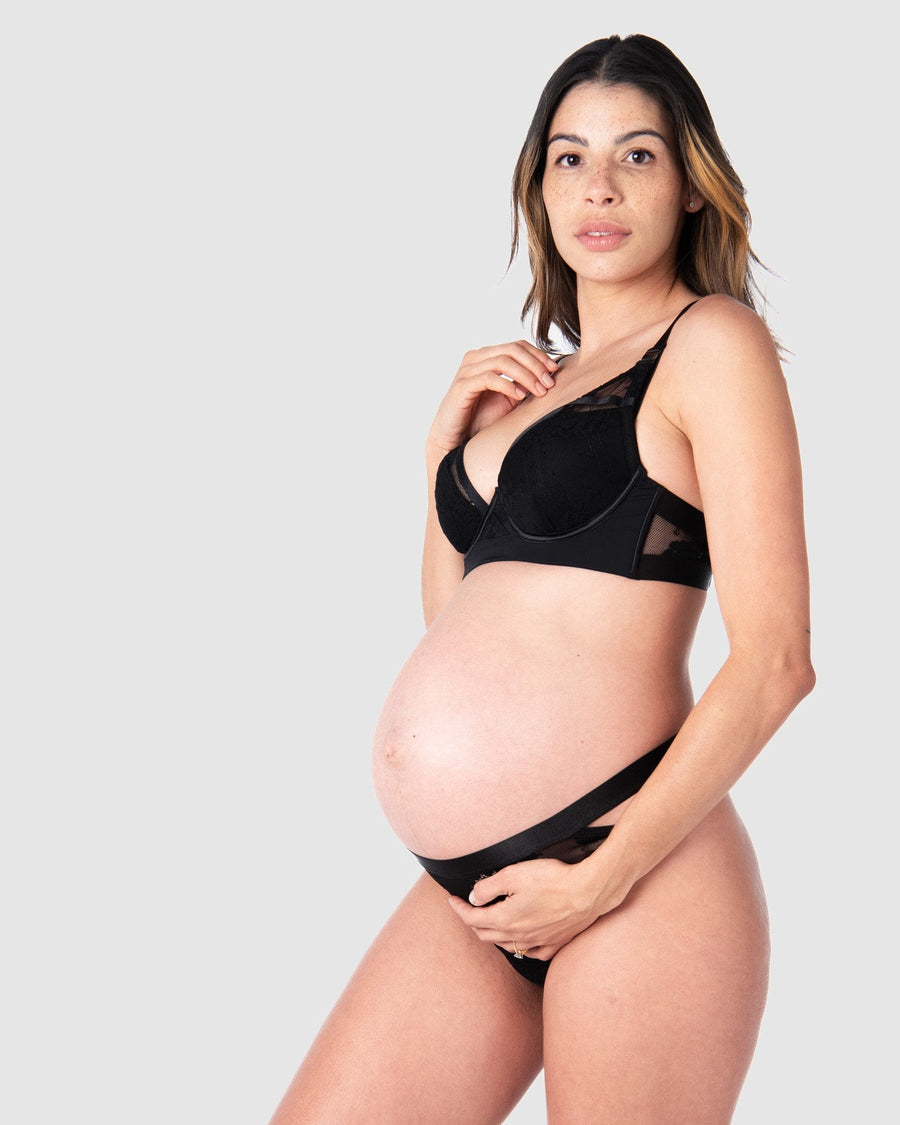 Kami, an expectant mother of 2, elegantly adorns Goddess, the edgy floral lace maternity and nursing bra by Hotmilk Lingerie. This bra features a half cup contour and flexi underwire support, enhancing its plunging style for an alluring touch on memorable date nights and special occasions