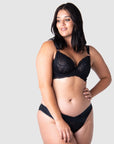 Olivia Radiates Confidence and Style in Hotmilk Lingerie's Heroine Plunge Maternity and Nursing Bra. Crafted with Sheer Lace, Twin Straps, and Elegant Rose Gold Magnetic Nursing Clips, this Bra Elevates Maternity and Nursing Wear to a New Level of Glamour