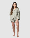 Tatiana, a mama of 1, flaunts the versatility of Hotmilk's mix-and-match collection. Seamlessly combining the Lounge Top with the Lounge Short, creating the perfect ensemble for warmer days and nights. Both pieces are expertly crafted from a soft linen blend in a serene Sage color, ensuring a comfortable fit with stylish 3/4 length kimono-style sleeves. This set exemplifies the harmonious blend of luxury and comfort, catering to the needs of pregnancy, breastfeeding, and postpartum care