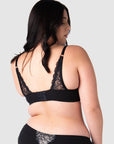 The Temptation Black Maternity and Nursing Bra features fully adjustable straps and a convertible racerback, offering versatile support tailored to your style. Its soft lace back, equipped with 6 rows of hook and eye closures, accommodates every stage of pregnancy and postpartum. Hotmilk Lingerie excels in creating nursing bras that seamlessly blend sensuality and functionality