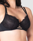 Take a closer look at the True Luxe by Hotmilk Lingerie US in black, showcasing its contemporary twin strap detailing, semi-sheer full cup coverage, and flexi underwire support. The modern signature magnetic nursing clips and center cutouts elevate this style to the next level of sophistication. Embrace empowerment throughout your breastfeeding journey with this exquisite bra, designed to accommodate cup sizes up to J cup, without making any compromises
