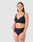 Tatiana exudes confidence, comfortably protected against light and unexpected leaks in Hotmilk Lingerie's Embrace Leakproof Bra in Black. This innovative take on the classic T-shirt bra is meticulously crafted from soft, eco-friendly bamboo yarn and features a leakproof foam cup. It ensures enduring freshness, dryness, and unwavering confidence for nursing mothers