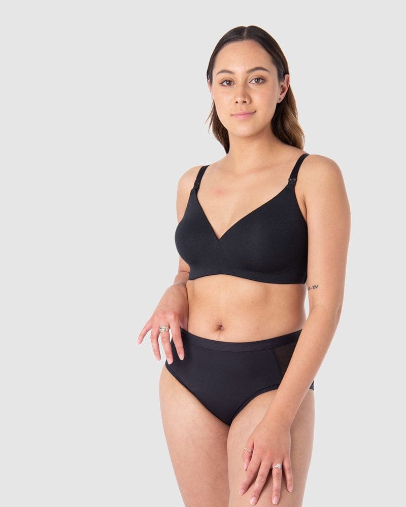 Tatiana exudes confidence, comfortably protected against light and unexpected leaks in Hotmilk Lingerie's Embrace Leakproof Bra in Black. This innovative take on the classic T-shirt bra is meticulously crafted from soft, eco-friendly bamboo yarn and features a leakproof foam cup. It ensures enduring freshness, dryness, and unwavering confidence for nursing mothers
