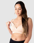 Tatiana Showcases Effortless Nursing Clip Usage on Hotmilk Lingerie's Groundbreaking Embrace Leakproof Bra, Revolutionizing the Classic T-shirt Bra. This Innovation Excels in Absorbing Up to 15 Milliliters of Liquid, While Maintaining the Desirable Silhouette of a Premium T-shirt Bra. Meticulously Crafted from Soft, Eco-friendly Bamboo Yarn and Enhanced with a Leakproof Foam Cup, It Ensures Prolonged Freshness, Dryness, and Unwavering Confidence for Nursing Mothers