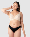 Full shot of Tatiana in Hotmilk Lingerie Heroine Plunge maternity and nursing bra, showing the relaxed fit of this flexi underwire. Fine twin straps provide both style and enhanced support. This bra showcases feminine lace with a sheer mesh lining. With 6 rows of hook and eye closures, it offers flexibility during pregnancy and postpartum stages