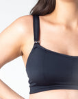 Explore the close-up details of Hotmilk Lingerie's maternity and nursing sports bra, lightly contoured for modesty. Crafted with slinky microfiber and traditional nursing clips, this versatile bra is perfect for breastfeeding on the go during light exercises, pilates, and yoga. Elevate your active maternity experience with the seamless blend of comfort, style, and convenience offered by the Hotmilk Lingerie maternity and nursing sports bra