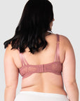 Olivia showing the back view of the Heroine nursing bralette in 36D-I by Hotmilk Lingerie US, highlighting the stunning soft lace back and multi-strap detailing. With 6 rows of hook and eye closures for flexibility, this versatile crop-style nursing bralette uniquely adapts to different sizes. Perfectly suited for the postpartum period, it caters to uncertain sizing needs and effortlessly adjusts to your evolving cup shapes throughout your entire breastfeeding journey