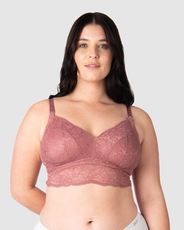 Olivia confidently wears the Heroine nursing bralette by Hotmilk Lingerie, featuring soft lace for everyday comfort. This versatile multi-fit nursing bralette adapts miraculously to various sizes, making it perfect for uncertain sizing needs. It evolves with your changing cup shapes during your entire breastfeeding journey