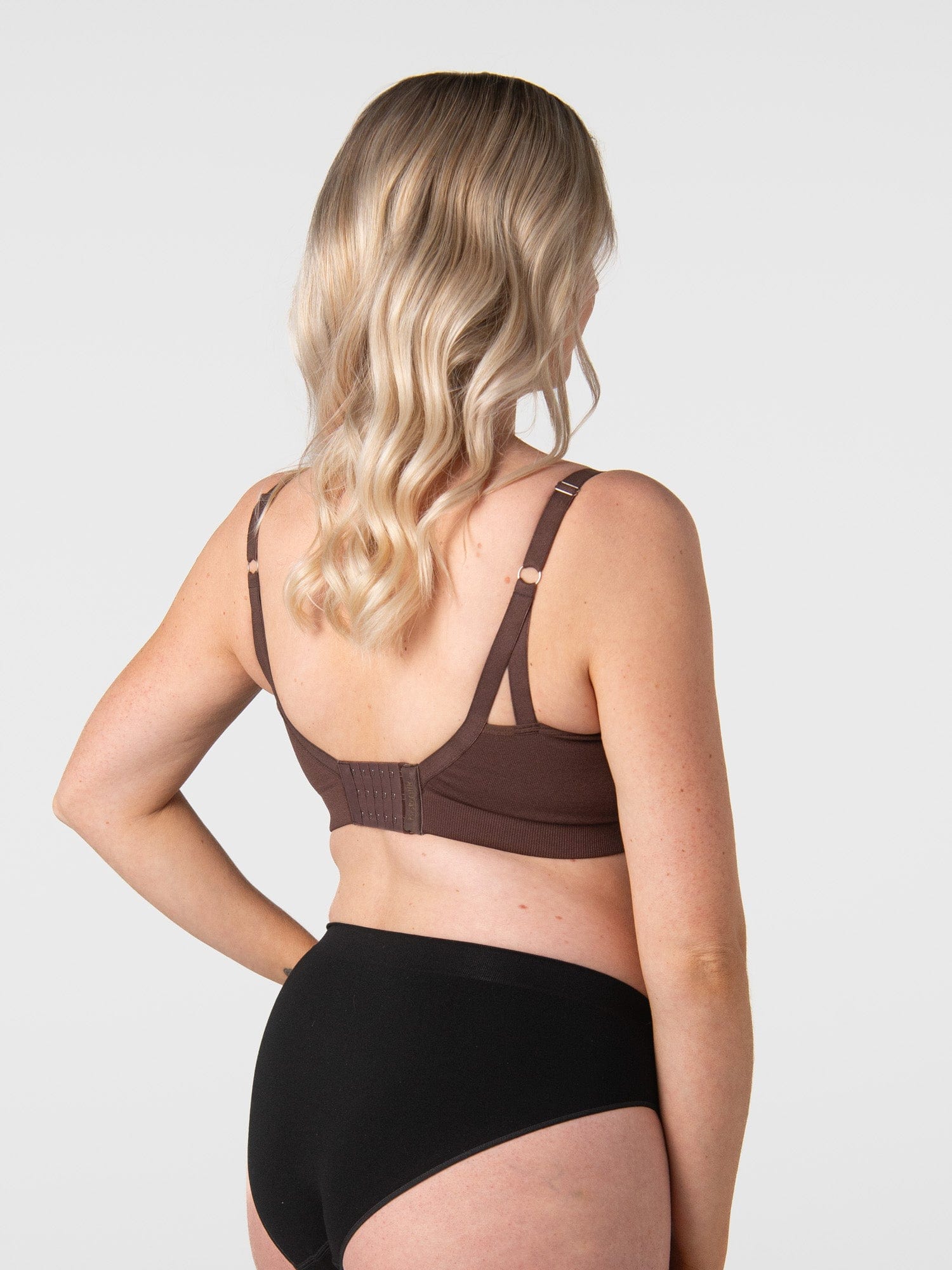 Adele wears My Necessity Chocolate back view showing clasps