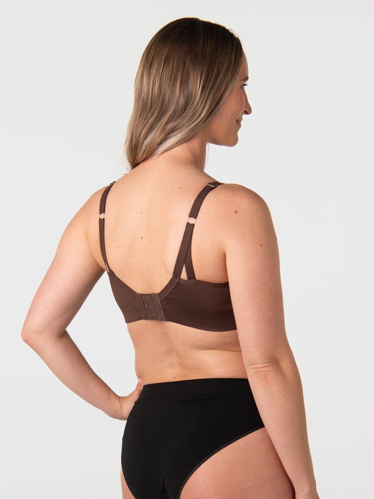 Brodie wears My Necessity Chocolate showing back and clasps