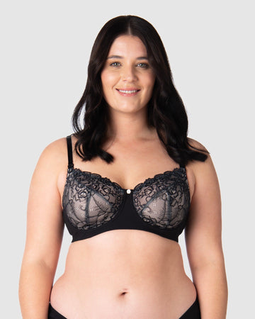Olivia elegantly showcases Hotmilk's award-winning flexi underwire maternity and nursing bra, Temptation in Black. This versatile everyday black lace full cup bra provides ample lift and support. With fully adjustable straps, it's suitable for both date nights and all-day wear, making it an ideal choice for breastfeeding mothers