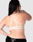 The nursing bra's soft sheer lace straps, delicately hued in shades of pink and featuring the flexibility of a convertible racerback, make it the perfect style to complement any outfit this wedding and party season. Equipped with 6 rows of hooks and eyes, it ensures flexibility throughout your pregnancy and postpartum journey. Hotmilk Lingerie US offers a nursing bra that harmoniously combines romantic style, flexi underwire support, and the comfort of soft cotton cups like no other