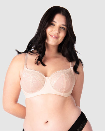 Experience complete support with Hotmilk Lingerie US's Temptation in Powder. This acclaimed award-winning style boasts flexi underwire, a hint of sheer lace over soft cotton cups, convenient nursing clips, and elevated all-day comfort and support. Olivia confidently wears size 14/36D in this essential nursing and maternity bra