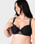 Olivia confidently wears size 14D in Hotmilk Lingerie's True Luxe Flexiwire nursing and maternity bra. Her demonstration highlights the modern signature magnetic nursing clips and center cutouts that elevate this style to the pinnacle of sophistication. The semi-sheer floral design of this nursing bra is tailored to accommodate cup sizes up to J, ensuring a perfect fit without any compromises