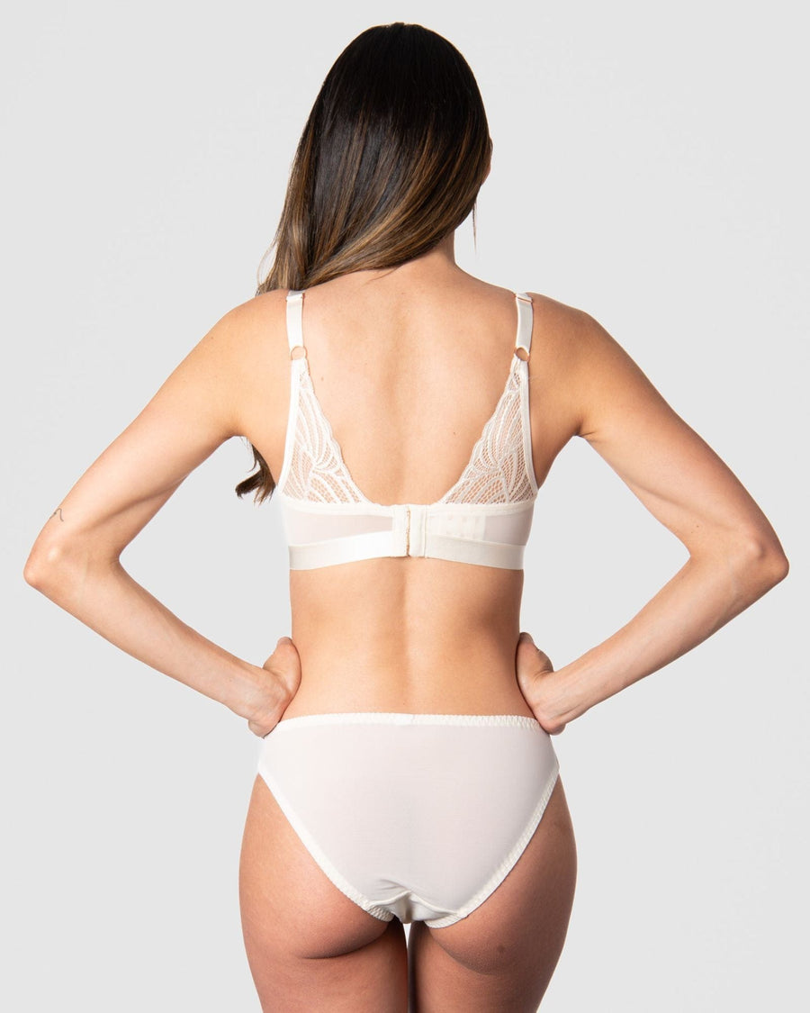 The style of Hotmilk Lingerie's Warrior Plunge Nursing Bra in Ivory extends beyond the captivating graphic lace feature on the back. With 6 rows of eye and hooks, this design accommodates the dynamic changes in a pregnancy and postpartum body, providing flexibility and comfort