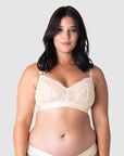 Discover ultimate comfort and style with Olivia embracing the Warrior Soft Cup by Hotmilk Lingerie. This wire-free maternity and nursing bra present a perfect fusion of lightness and youthfulness, featuring rose gold magnetic nursing clips and sheer graphic lace for a contemporary touch. Immerse yourself in the seamless combination of comfort and style, making this modern maternity essential a must-have