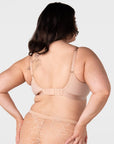 Rear view of model wearing the Hotmilk Flawless Plunge Wirefree Nursing Bra in Cashmere – showing 6-hook back closure, gold adjustable straps, and double-layer smoothing back panel with matching lace briefs