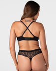 Forever New black maternity t-shirt bra worn in racerback style with crossed-over adjustable straps and wide 6 hook closure