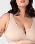 Close-up front view of the Hotmilk My Comfort Nursing Bra in Oat – showing soft ribbed bamboo-blend fabric, wide smoothing straps, and deep plunge wrap neckline