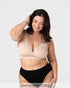Model smiling wearing the Hotmilk My Comfort Nursing Bra in Oat with black Hotmilk briefs – full body front view showing wirefree silhouette and everyday relaxed fit