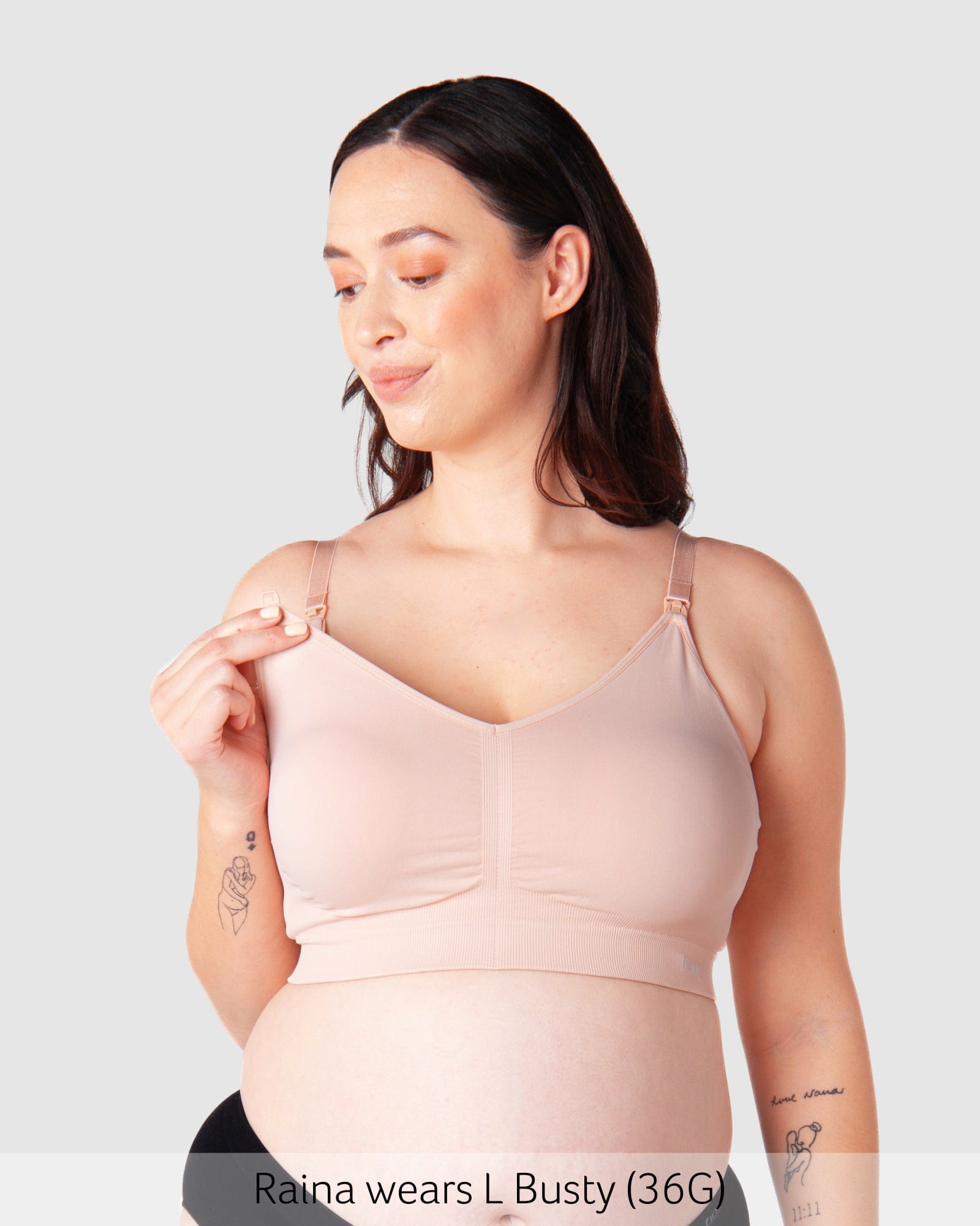 Model wearing Hotmilk My Necessity bra in Ballet Pink, showing front view with nursing clips and full cup support.
