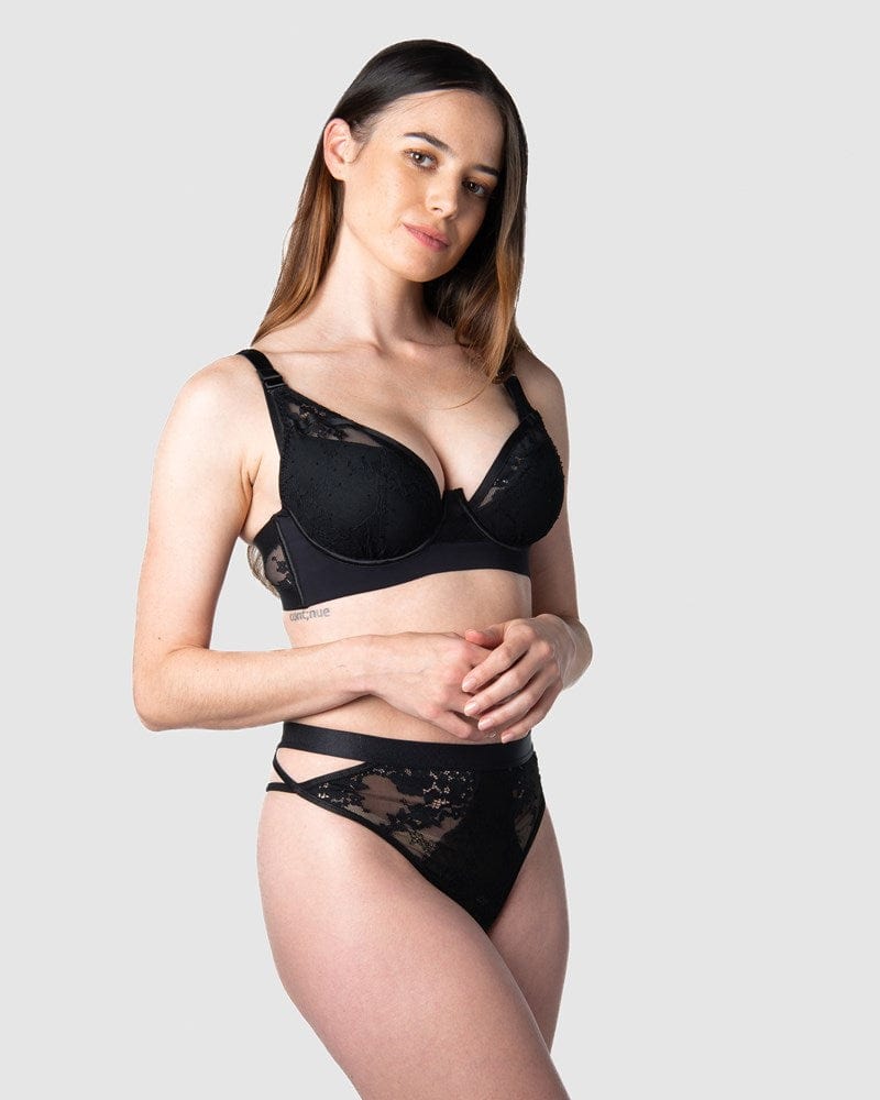 Hotmilk Lingerie's Goddess g-string forms a captivating date night ensemble, beautifully matched with the Goddess Plunge bra as modeled by Emily, a mother of 1. This set showcases edgy strap details and intricate large floral lace