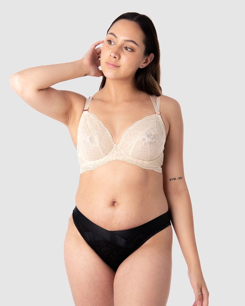 Full shot of Tatiana in Hotmilk Lingerie Heroine Plunge maternity and nursing bra, showing the relaxed fit of this flexi underwire. Fine twin straps provide both style and enhanced support. This bra showcases feminine lace with a sheer mesh lining. With 6 rows of hook and eye closures, it offers flexibility during pregnancy and postpartum stages