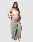 Meet Kami, a mother of 2, proudly showcasing Hotmilk's 'Sage Lounge Pant' paired with the Lounge Robe and My Necessity nursing bra during her 9th month of pregnancy. These pants are the perfect fusion of sumptuous linen, a soft waistband, and a flattering 7/8 length that ensures both style and comfort. Discover the ultimate loungewear for pregnancy and postpartum relaxation with Hotmilk US's Sage Lounge Pant