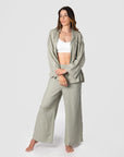 Explore boundless possibilities with Kami, a mother of 2, as she demonstrates Hotmilk US mix-and-match collection by combining the Lounge Top with the Lounge Pant. Crafted from a soft linen blend in a serene Sage color, these pieces offer a comfortable fit and stylish 3/4 length kimono-style sleeves. To complete her perfect loungewear ensemble, Kami adds the My Necessity maternity and breastfeeding bra, ensuring both fashion and functionality in her set